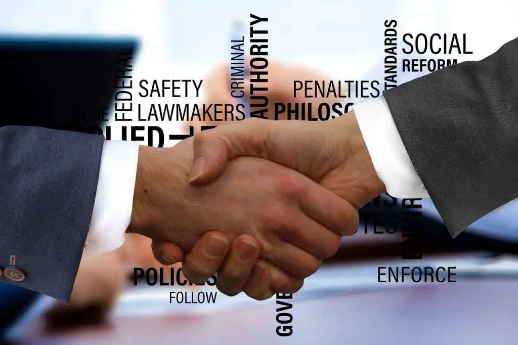 Shaking Hands Handshake Contract 3205463 1024x682 Contractual handshake representing the operational reality of law
