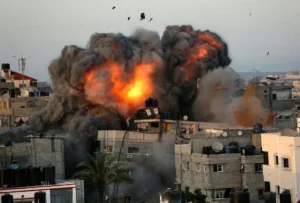 A ball of fire erupts from a building in Gaza Citys Rimal residential district on May 16 2021 during massive Israeli bombardment on the Hamas controlled enclave